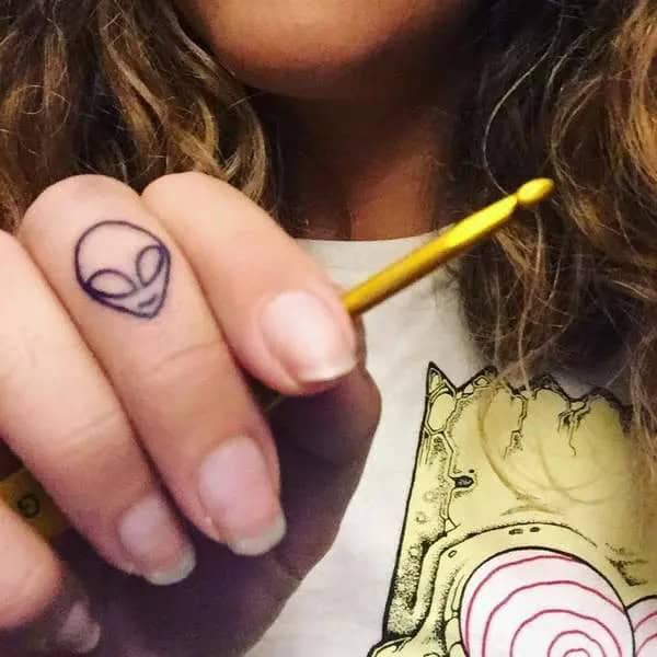 Alien Finger Tattoo