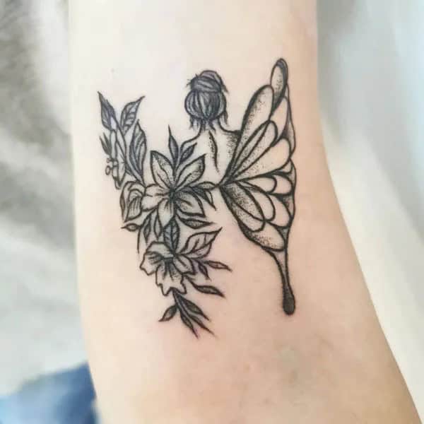 Half butterfly half flower forearm tattoo