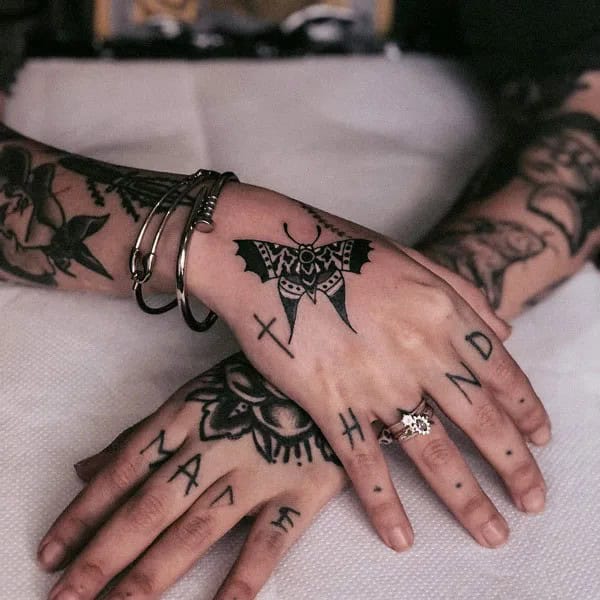 Traditional Butterfly Hand Tattoo