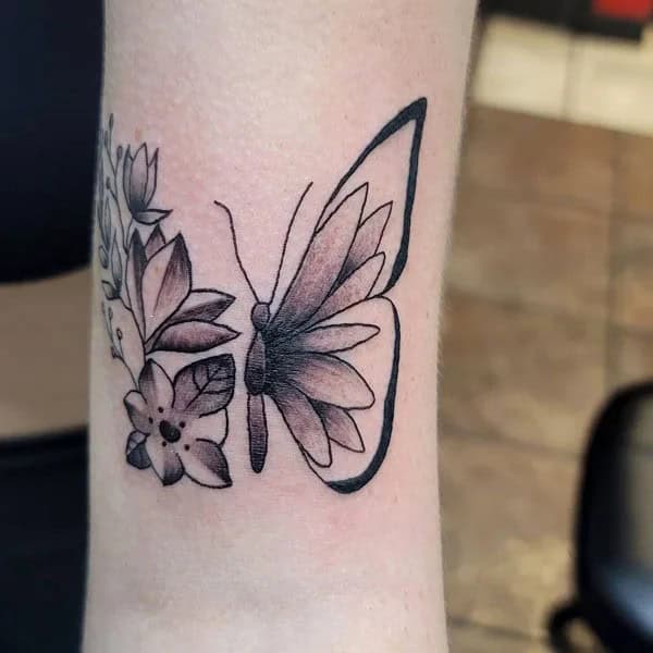 Half butterfly half flower forearm tattoo