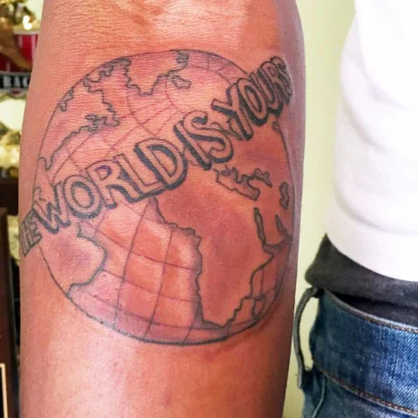 “The World Is Yours” Finger Tattoo