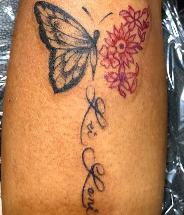 Half butterfly half flower forearm tattoo