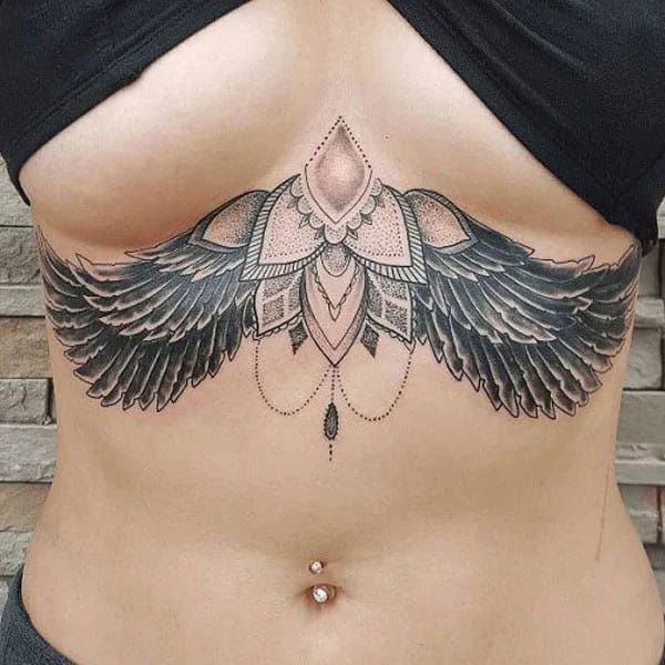 Wings Under Breast Tattoo