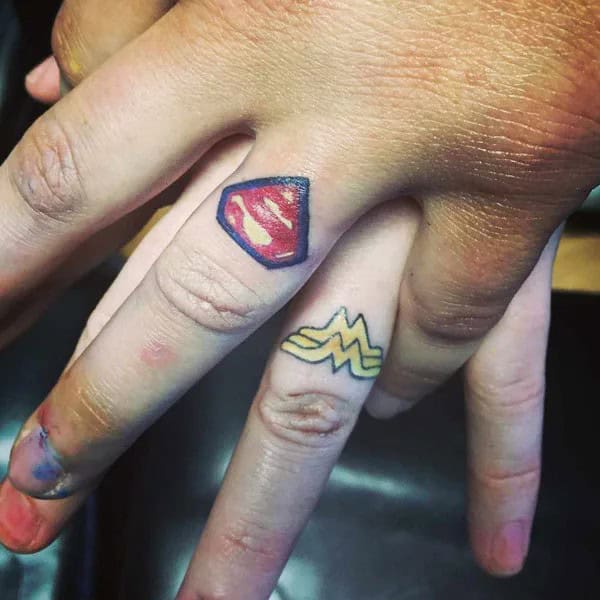 Superman and Wonder Woman Wedding Ring Tattoo