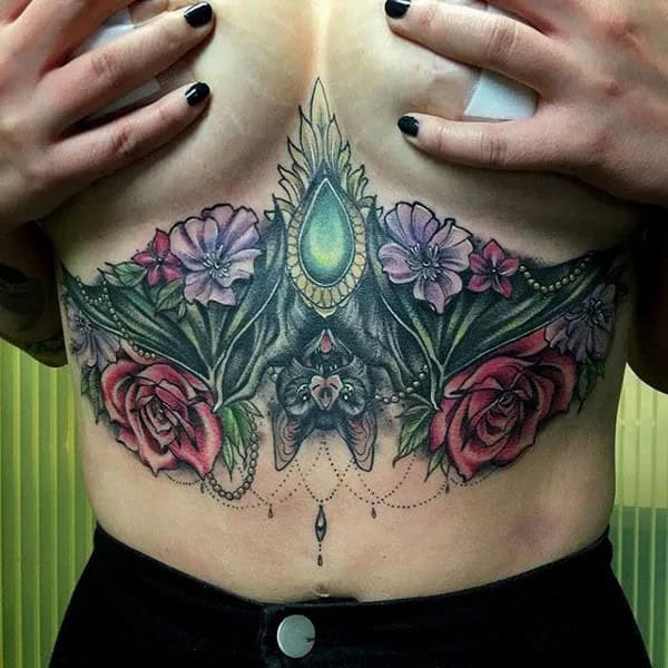 Bat Under Breast Tattoo