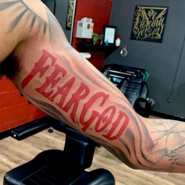 Fear God Tattoo on Bicep