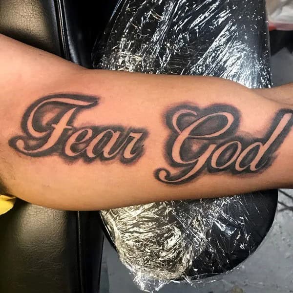 Fear God Tattoo on Bicep