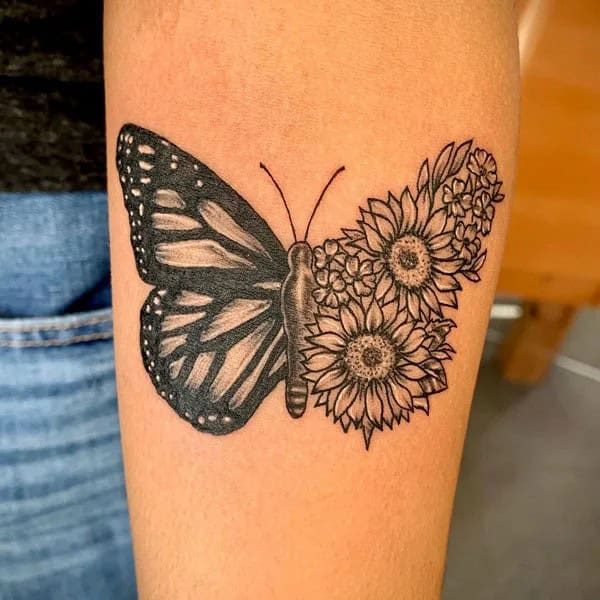 Half butterfly half flower forearm tattoo