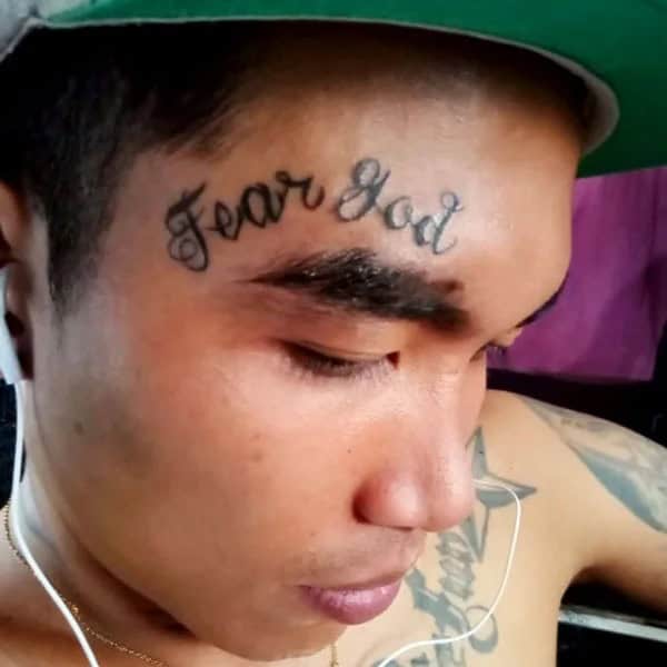 Fear God Tattoo on Forehead