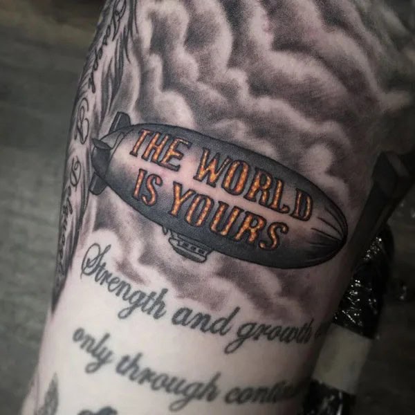 “The World Is Yours” Finger Tattoo