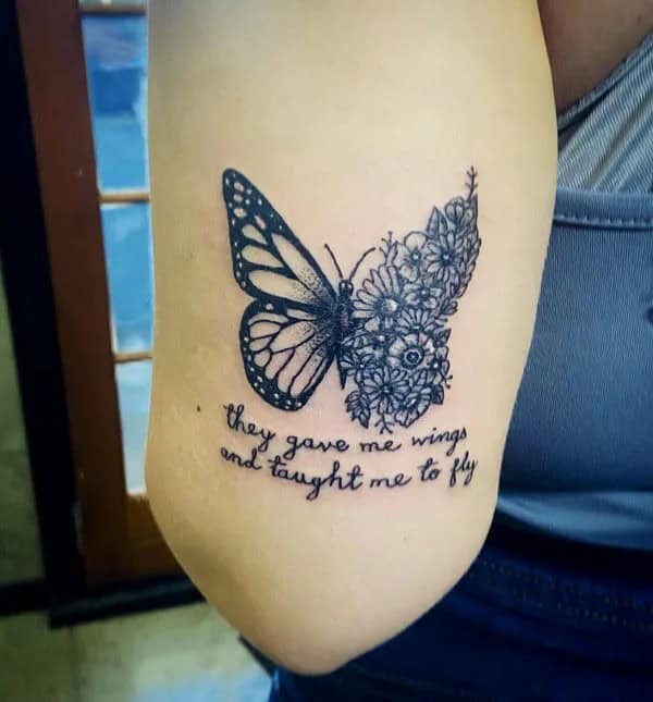 Half butterfly half flower forearm tattoo