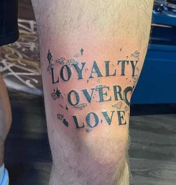 Loyalty Over Love Tattoo Above Knee