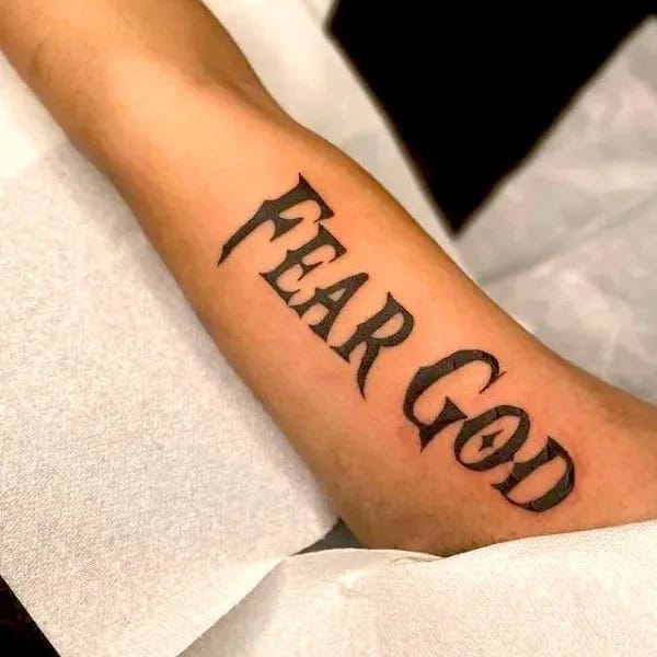 Fear God Tattoo on Bicep