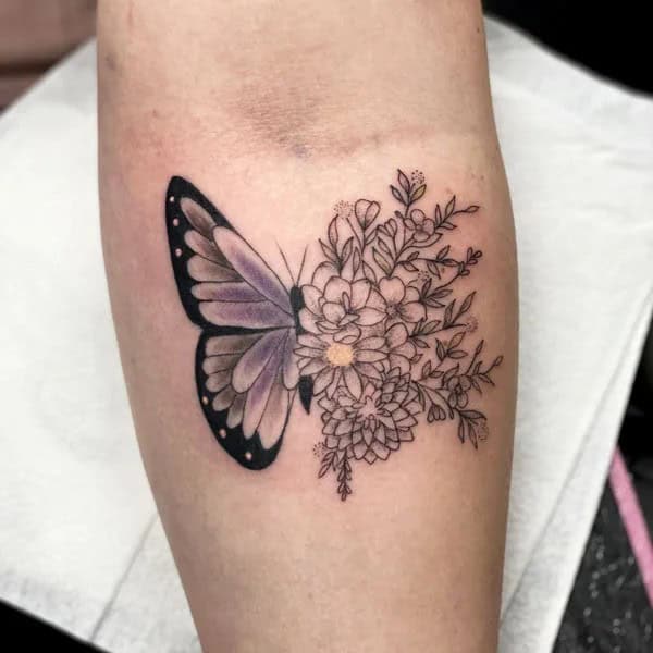 Half butterfly half flower forearm tattoo