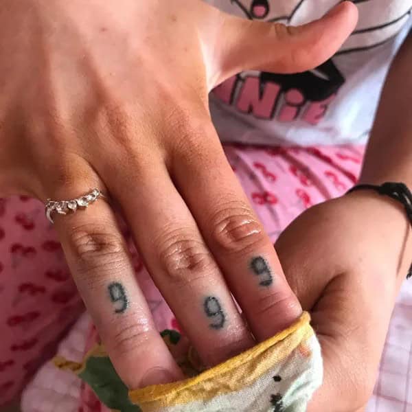 999 Tattoo on Finger