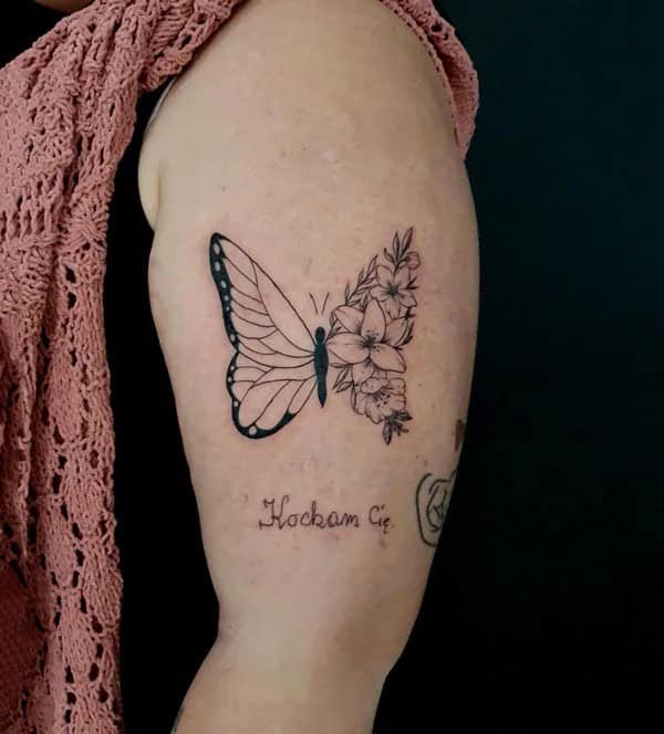 Half butterfly half flower forearm tattoo