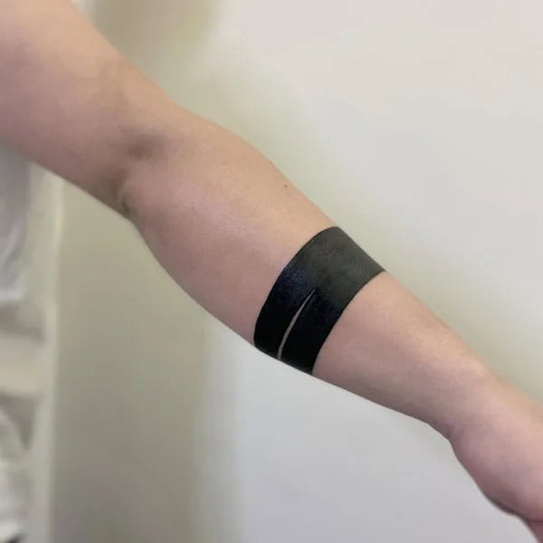 Negative Space Armband Tattoo