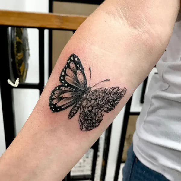 Half butterfly half flower forearm tattoo