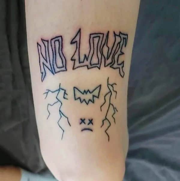 No Love Tattoo Above The Knee