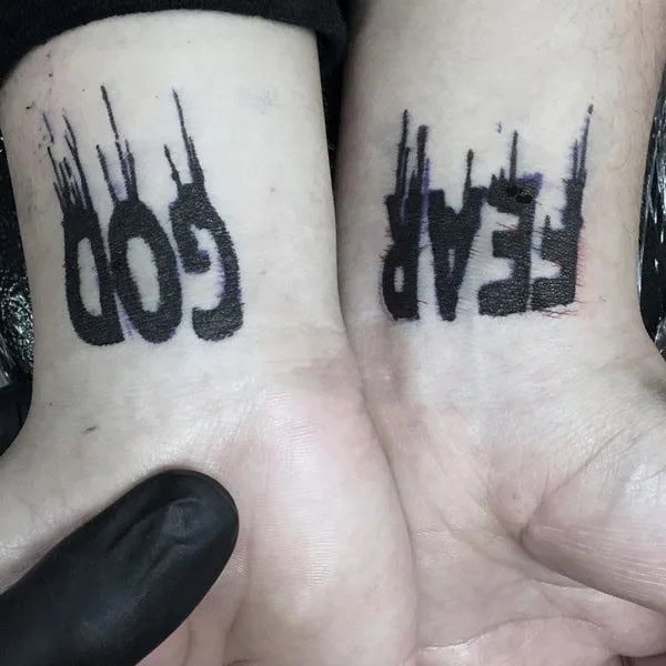 Fear God Tattoo on Wrist