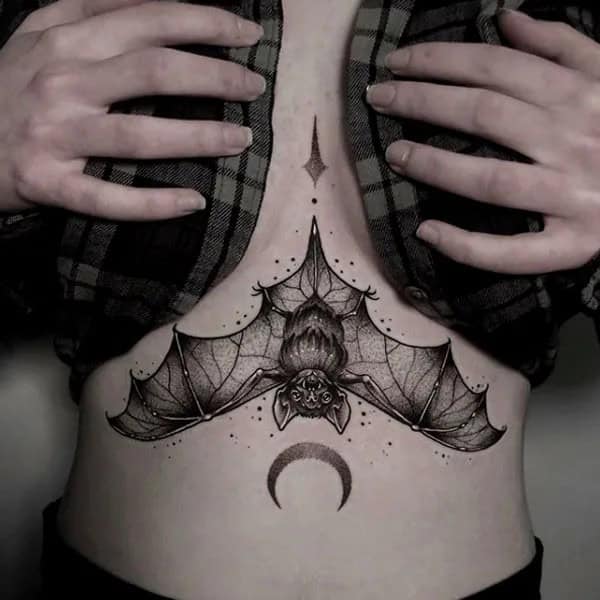 Bat Under Breast Tattoo