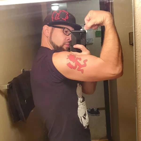 Bicep Hatchet Man Tattoo