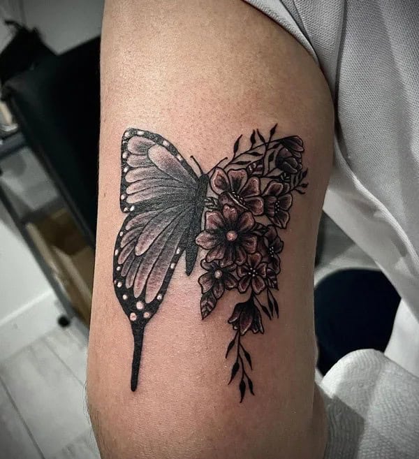 Half butterfly half flower forearm tattoo