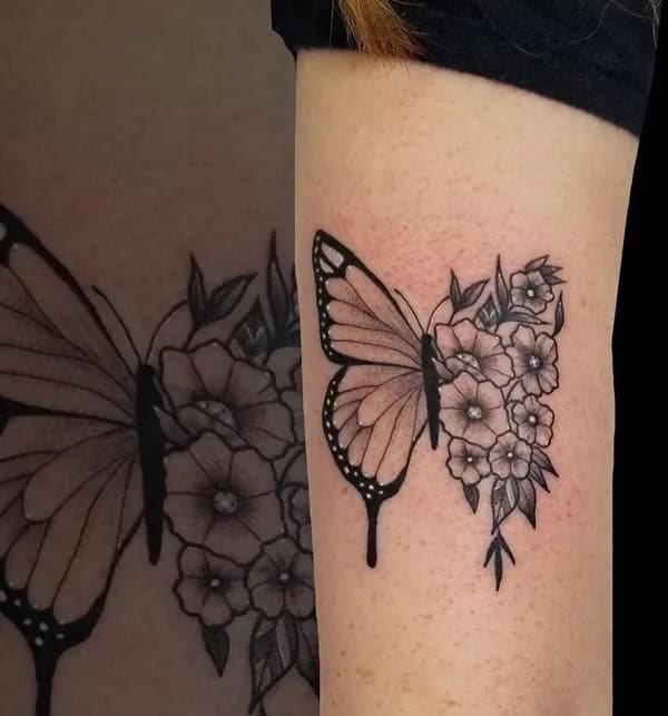 Half butterfly half flower forearm tattoo