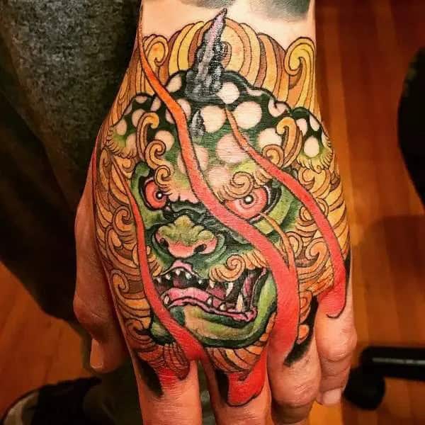 Foo Dog Hand Tattoo