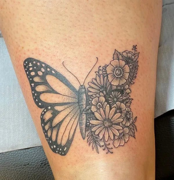 Half butterfly half flower forearm tattoo