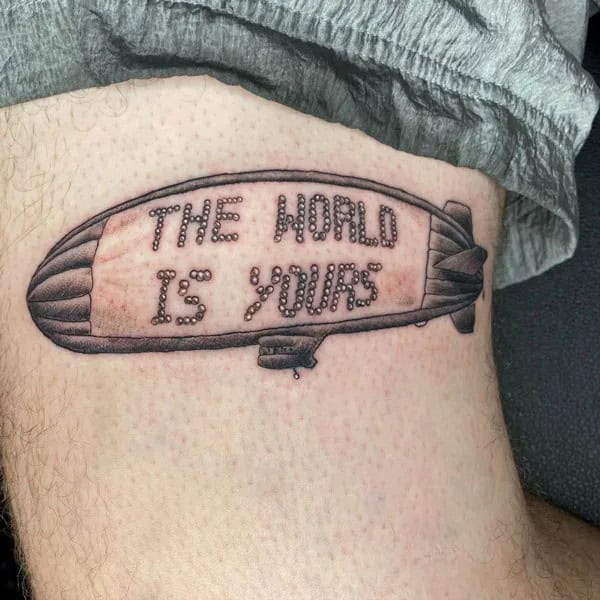 “The World Is Yours” Finger Tattoo