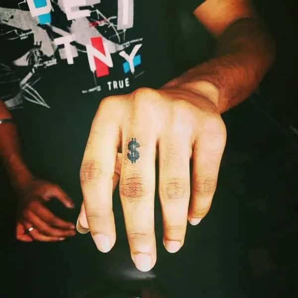 Dollar Sign Finger Tattoo