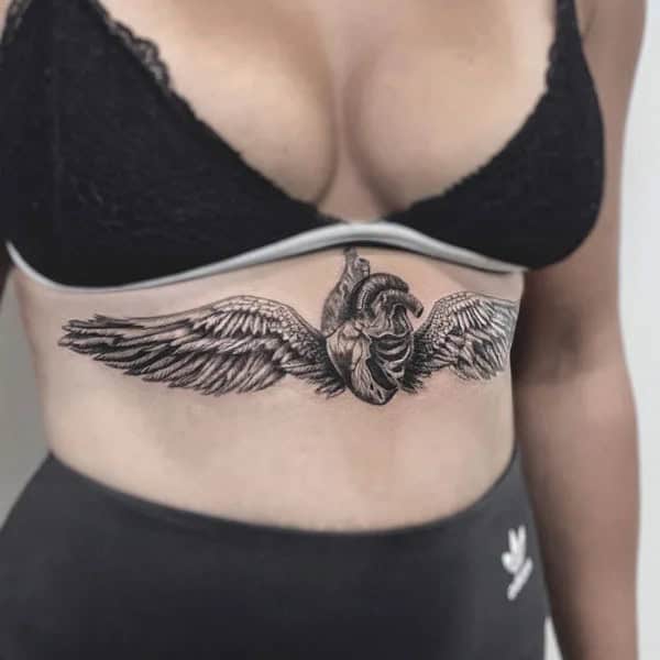 Wings Under Breast Tattoo