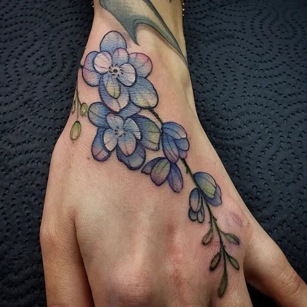 Larkspur Hand Tattoo