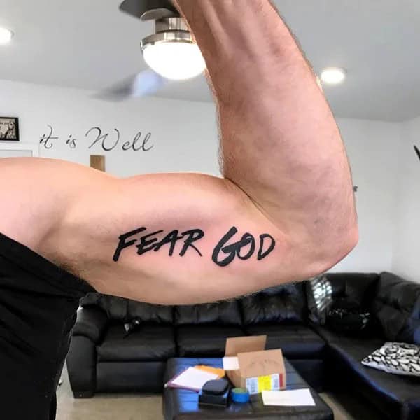 Fear God Tattoo on Bicep