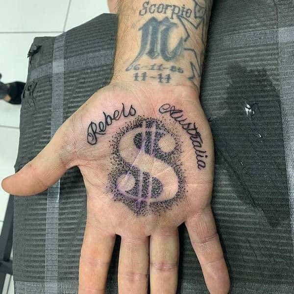 Dollar Sign Hand Tattoo