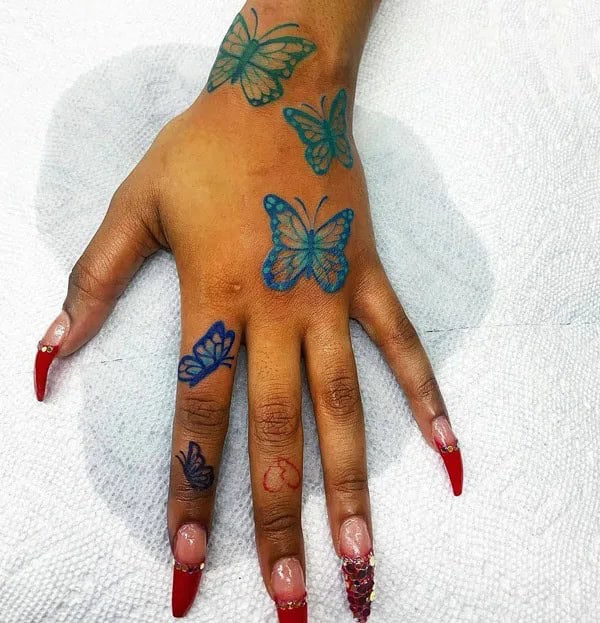 Blue Butterfly Hand Tattoo