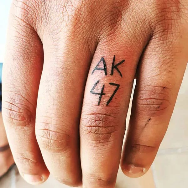 AK-47 Finger Tattoo