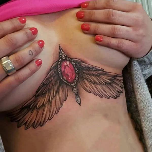 Wings Under Breast Tattoo