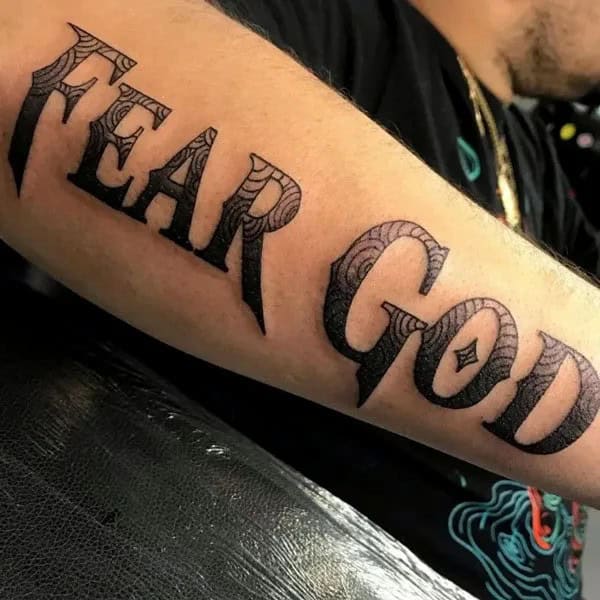 Fear God Tattoo on Forearm