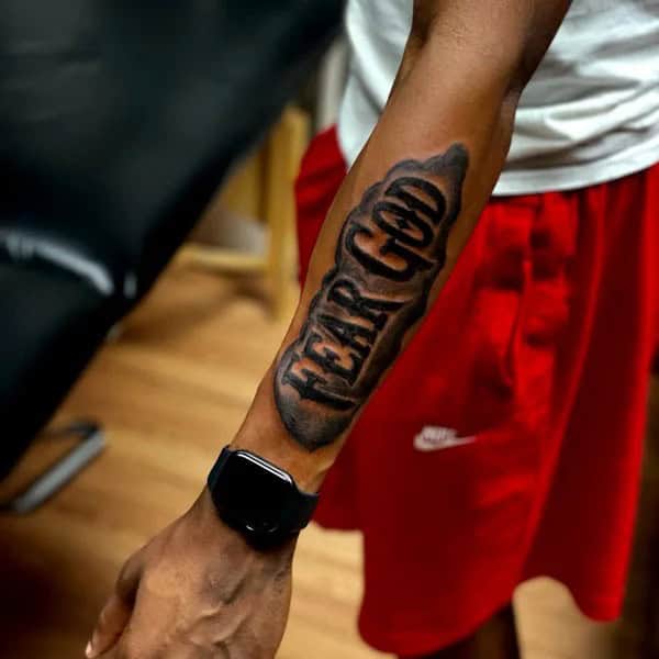 Fear God Tattoo on Forearm