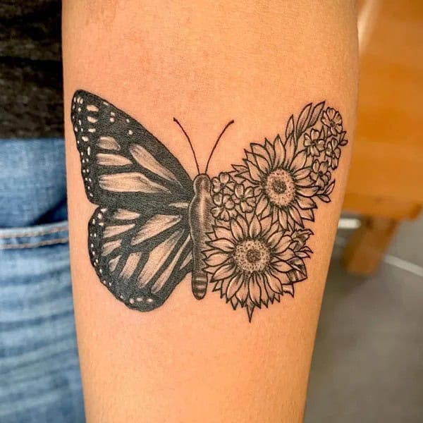 Half butterfly half flower forearm tattoo