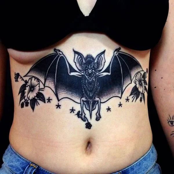 Bat Under Breast Tattoo