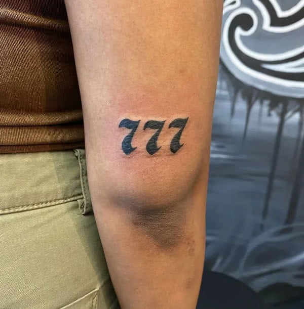 Behind the ear 777 Tattoo