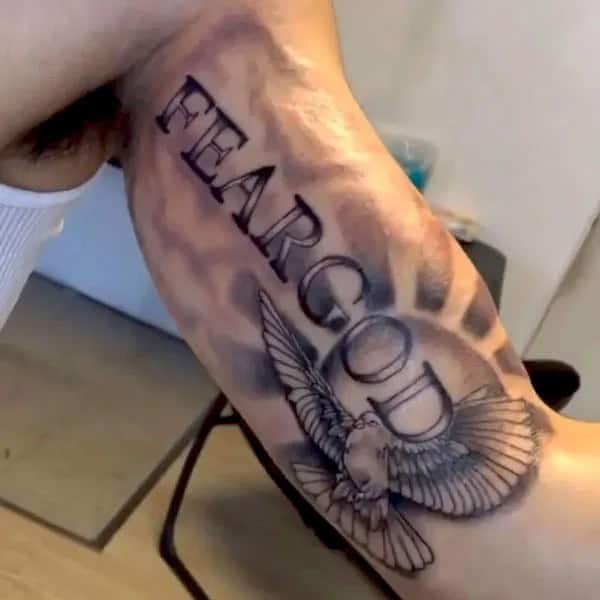 Fear God Tattoo on Bicep