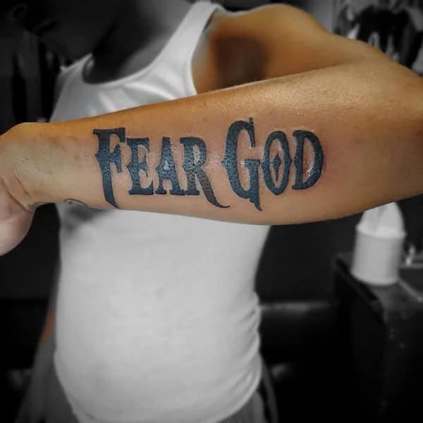 Fear God Tattoo on Forearm