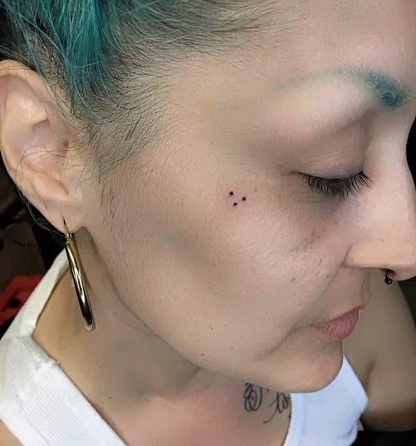 Three Dots Face Tattoo