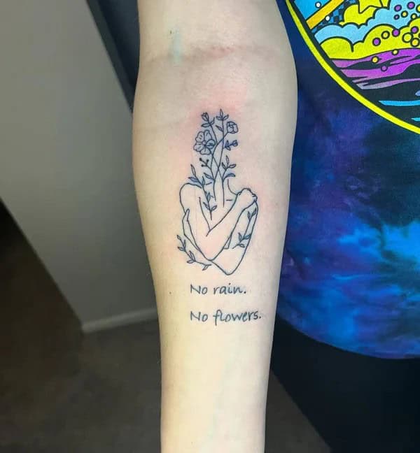 “No Rain No Flowers” Tattoo on Forearms