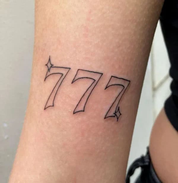 Behind the ear 777 Tattoo