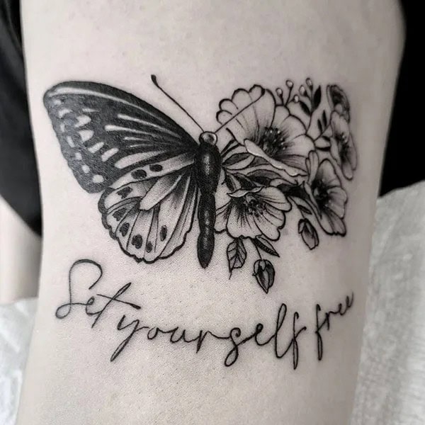 Half butterfly half flower forearm tattoo